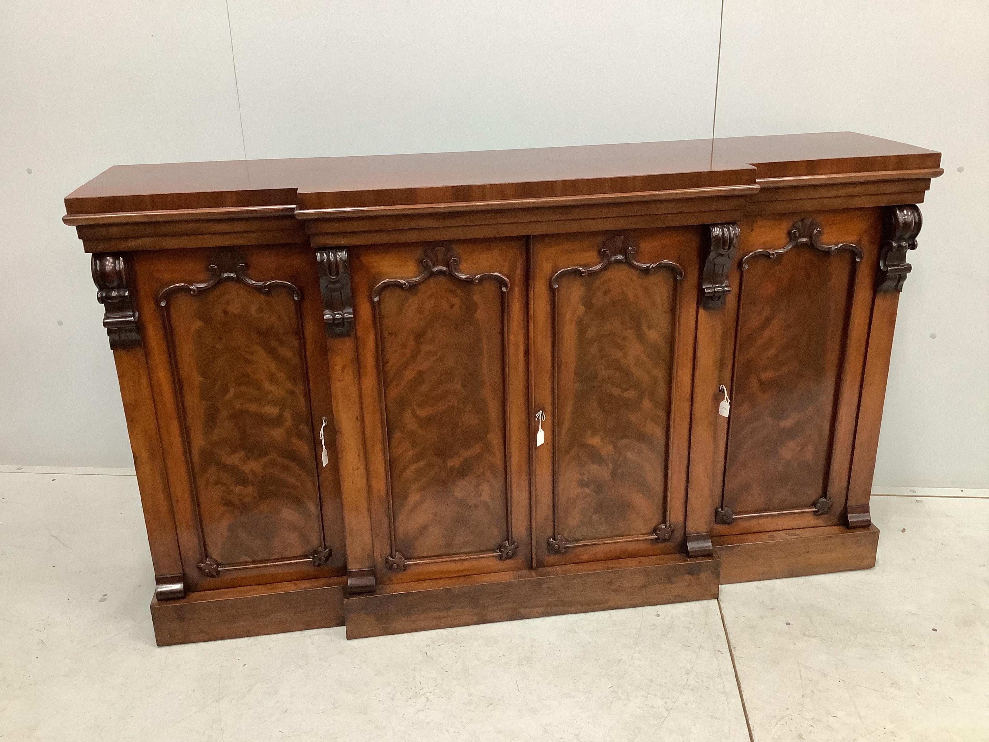 A mahogany breakfront dwarf bookcase, width 170cm, height 99cm. Condition - fair to good